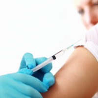 A picture of a nurse giving injection